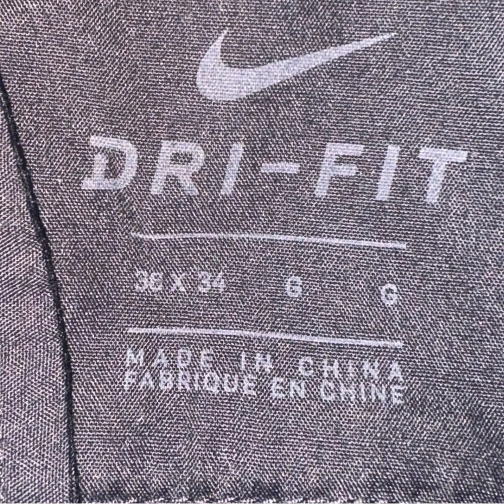 Nike Dri-Fit pants 95% Polyester 5% Spandex Black color Vented cuffs belt loops‎